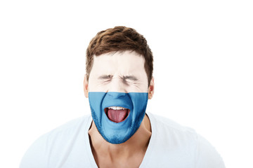 Screaming man with San Marino flag on face.