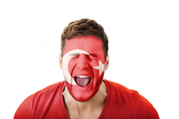 Screaming man with Turkey flag on face.