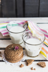 Rustic home made cookies on the wooden background with milk