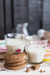 Rustic home made cookies on the wooden background with milk