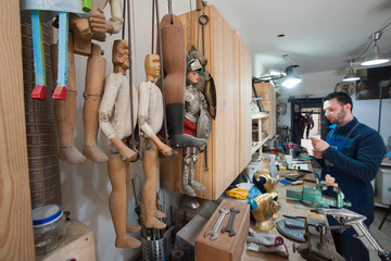 Sicilian puppets' artisan at work