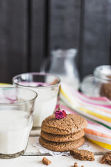 Rustic home made cookies on the wooden background with milk