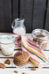 Rustic home made cookies on the wooden background with milk