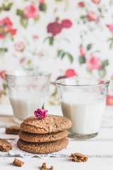 Rustic home made cookies on the wooden background with milk