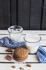 Rustic home made cookies on the wooden background with milk
