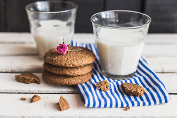 Rustic home made cookies on the wooden background with milk
