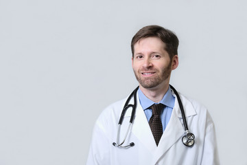 Smiling Physician with beard wearing stethoscope