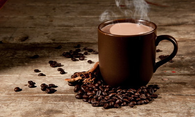 Coffee cup on a wooden table. Dark background.