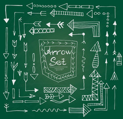 Hand drawn arrow icons set on green chalk board