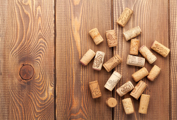 Wine corks over rustic wooden table background