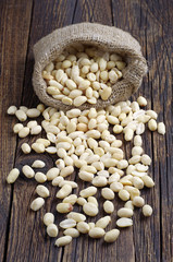 Peanuts on wooden background