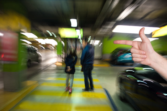 Man pointing  in the parking garage