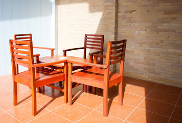 table and four chairs in an apartment against  wall