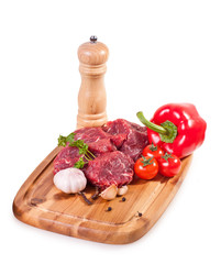 meat and vegetables on white background