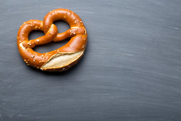 baked pretzel on a chalkboard