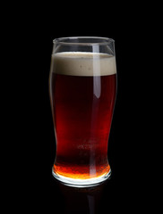 A glass of dark beer.