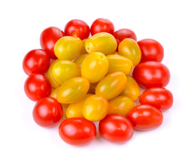 Group of ripe red and gold grape tomatoes isolated against white