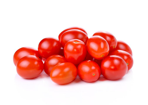 Pile of red grape tomatoes isolated on white background