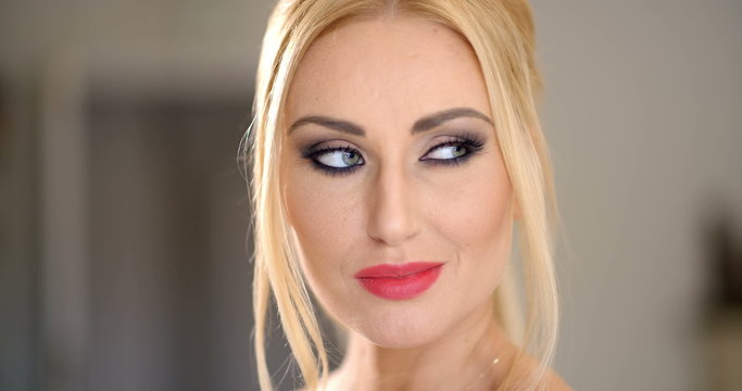 Pretty Blond Woman Face with Hand on the Chin