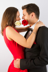 Loving couple in bright clothes dancing