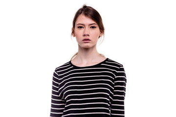 Pretty young teenager girl looking at camera innocently