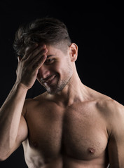 Muscular shirtless young man portrait isolated