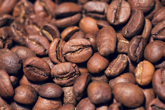 Brown coffee beans, close-up of coffee beans for background 