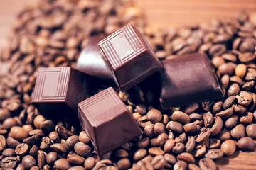 Chocolate and coffee beans on wooden table