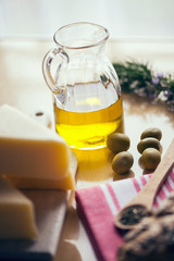 Arrangement of olive oil and cheese