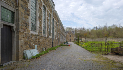 Fototapeta na wymiar Footpath through the park of an abbey in spring