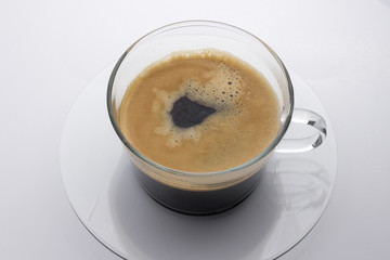 Black coffee in Glass with Saucer