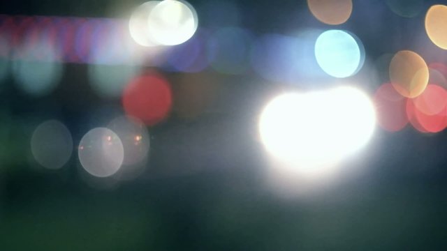 Defocused carlights in the night toned colorized footage