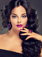 Model  curly hair and jewelry , violet mup , manicure on nails