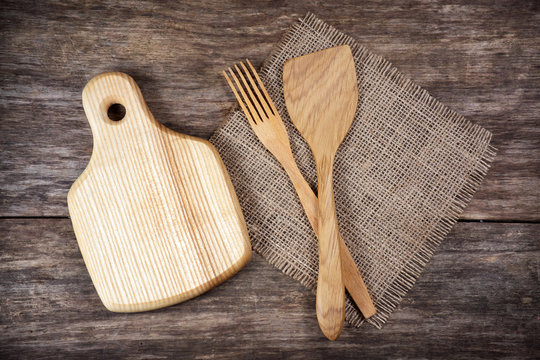 Empty chopping board and kitchen utensils