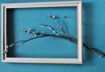 pussy willow branch in wooden frame