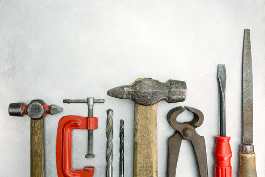 Set of old tools on metal background