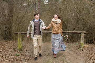 Loving couple in the forest in spring