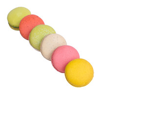 Colorful macarons on white background