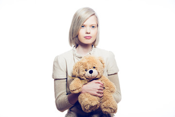 young blonde woman with teddy bear