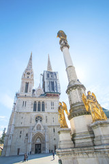 Fototapeta premium Cathedral in Zagreb and statue of Our Lady in morning, vertical