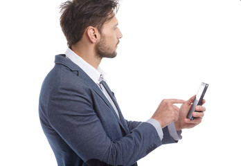 Young businessman talking on mobile isolated on white background