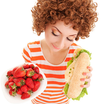 Fun woman with strawberry and sandwich on the white background