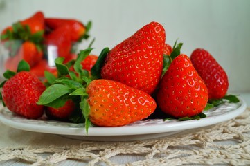 fresh strawberries on a white plate