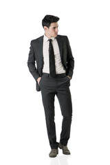 Obraz na płótnie Canvas Full figure shot of handsome elegant young man in business suit