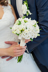Bride holding a beautiful wedding bouquet