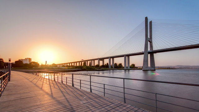 Vasco da Gama bridge during sunset and ebb-tide in Lisbon