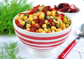 vegetarian salad with chickpeas, dried tomatoes, capers and dill