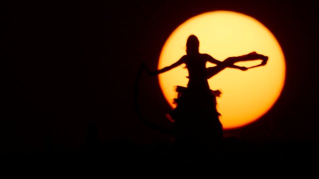Silhouette of a dancer dancing at sunset