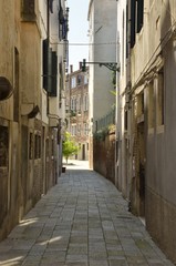 Fototapeta premium Narrow street in Venice, Italy