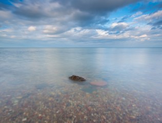 Rocky shore of sea. Long exposure seascape.